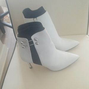 Black and white leather ankle boots in excellent condition,stored in orginal box